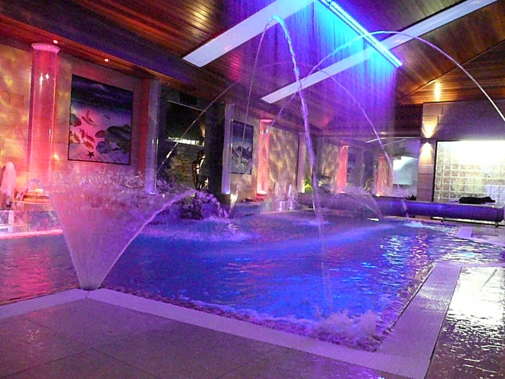 Indoor pool with RGB illuminated laminar jets