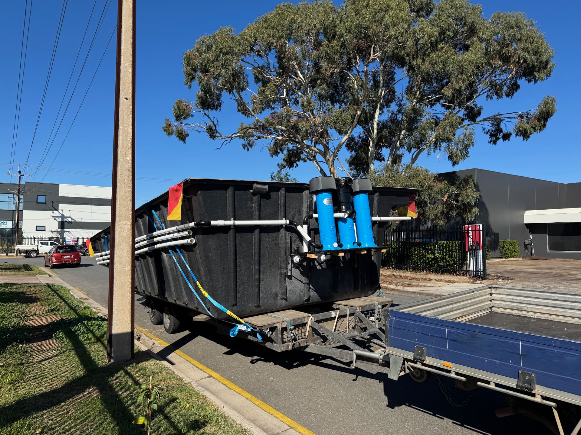 SKUMP self-powered pool equipment unit on a trailer, showing integrated pumps, filters and solar-ready plumbing