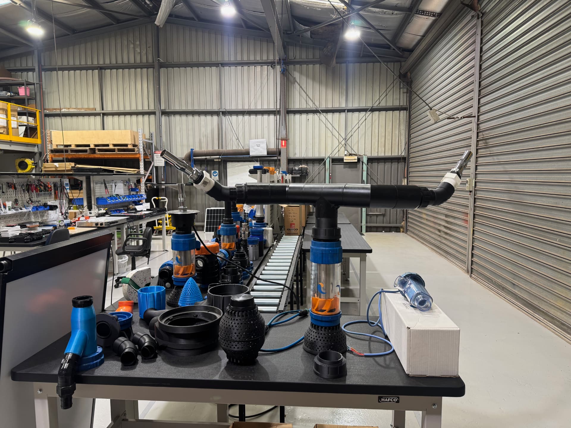 IZEP pump components on the workbench in the SOLAFLO workshop