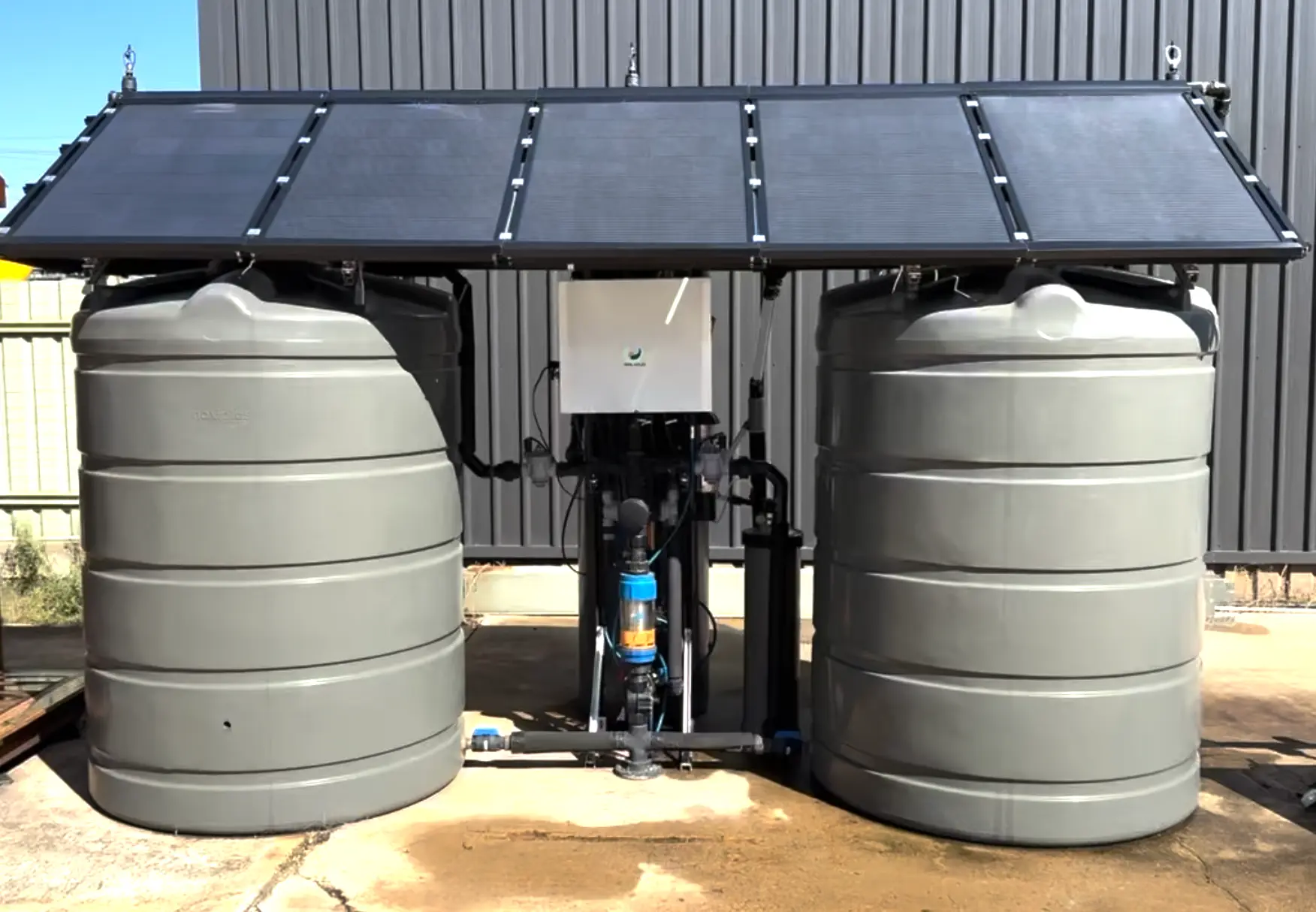 Solar powered rainwater pressurisation system with dual tanks and PV panels