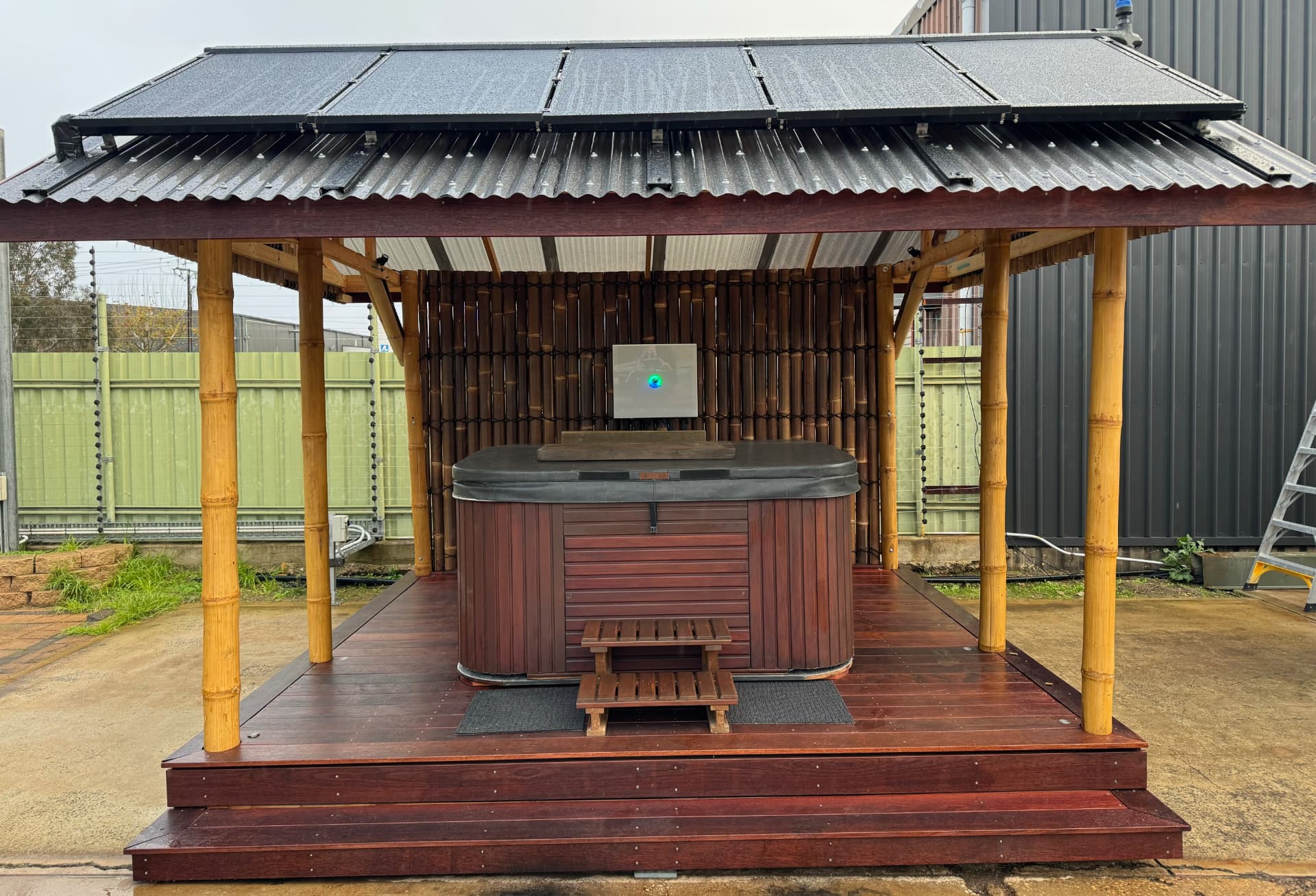 Solar thermal spa installation with PV+T panels mounted on a bamboo gazebo roof